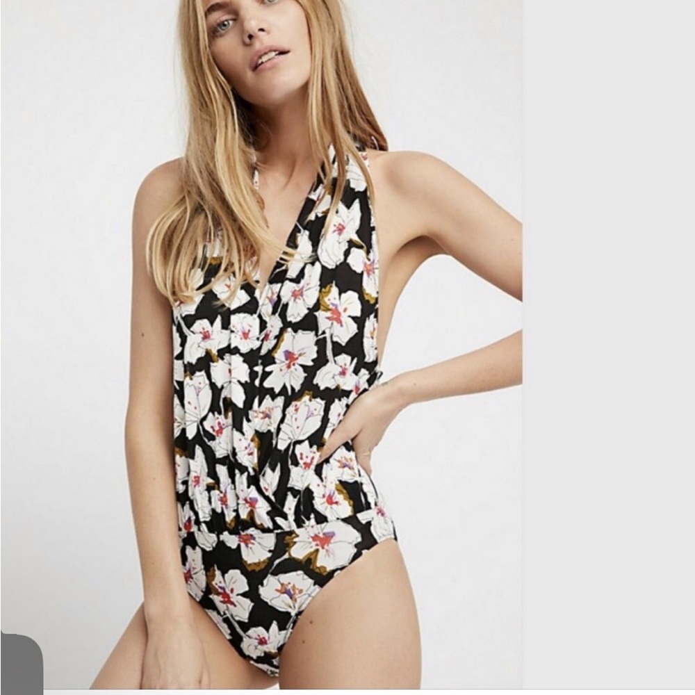 Free people floral body suit- size small. Snap closure- no issues.